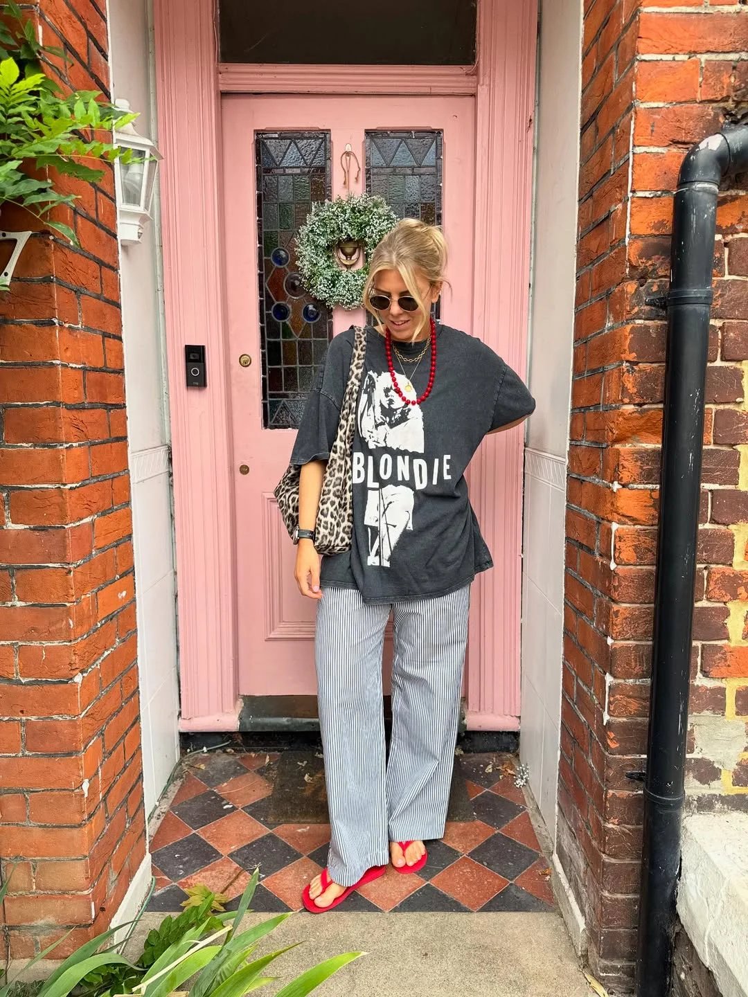 19 summer romper outfits for women 2026 Graphic Tee And Striped Pants For A Playful Summer Off-Duty Look