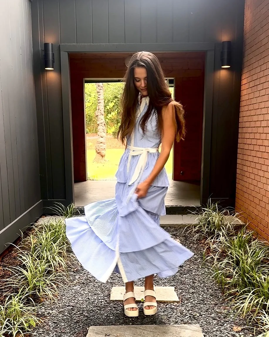19 summer romper outfits for women 2026 Blue Striped Flowing Romper Dress With A White Tie Waist