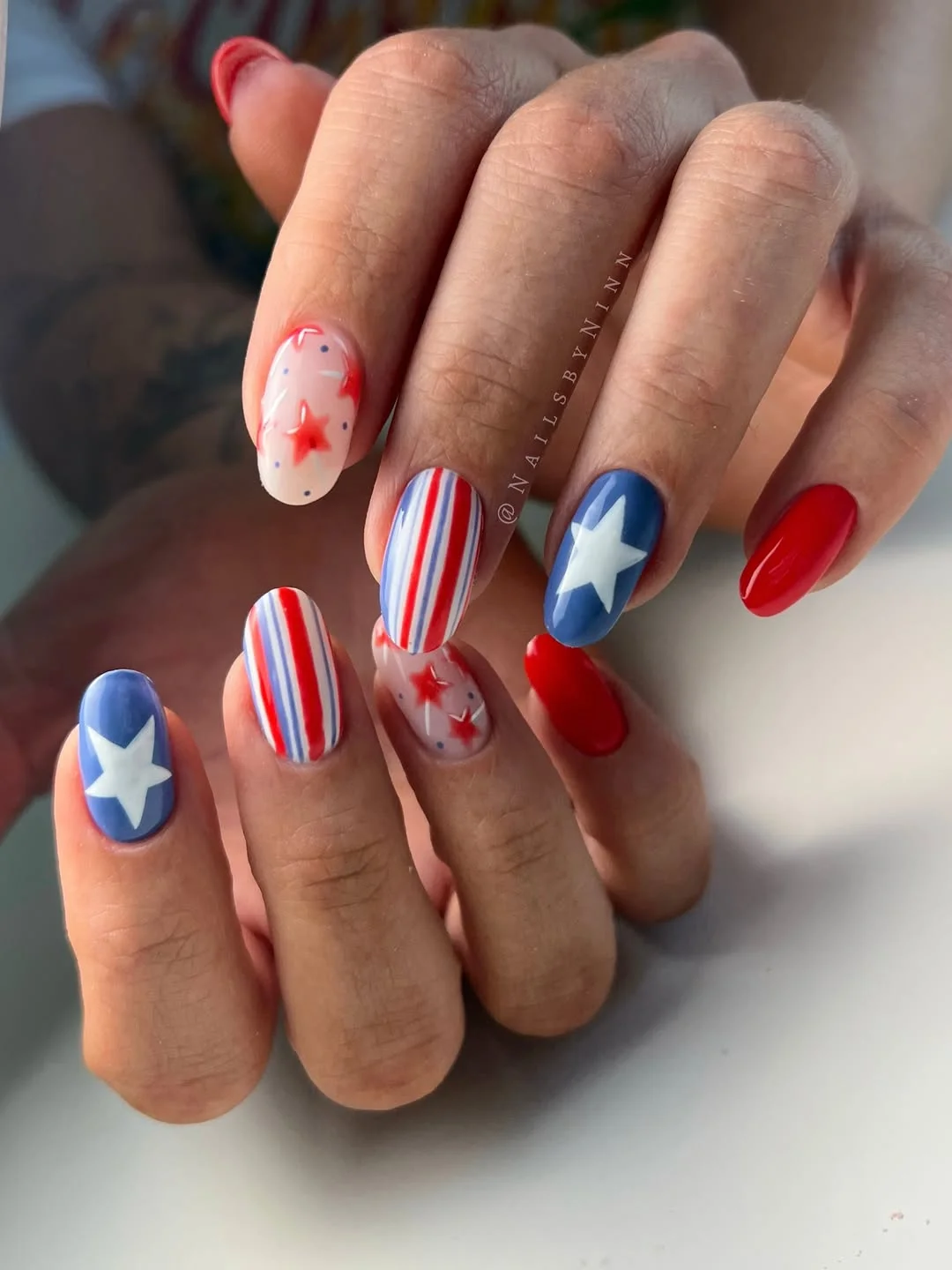 4th of july nails 2026 Classic Stars and Stripes Nails With Glossy Red Accents