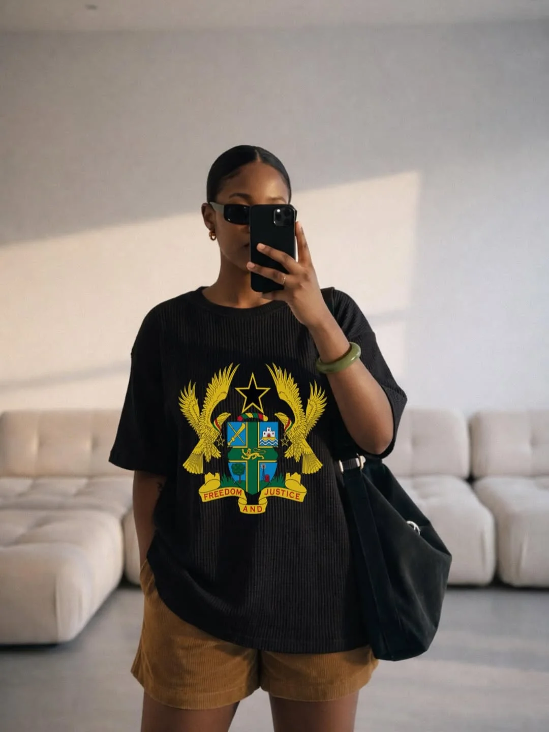casual summer t-shirt outfit for women 2026 Black Graphic Tee With Brown Summer Shorts