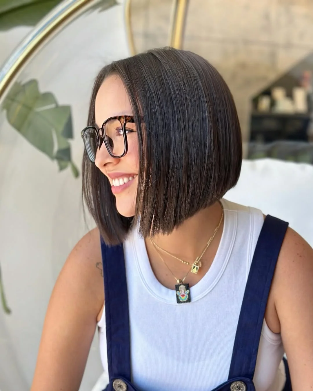 chic summer haircut 2026 Sleek Chin-Length Bob With a Sharp Summer Edge