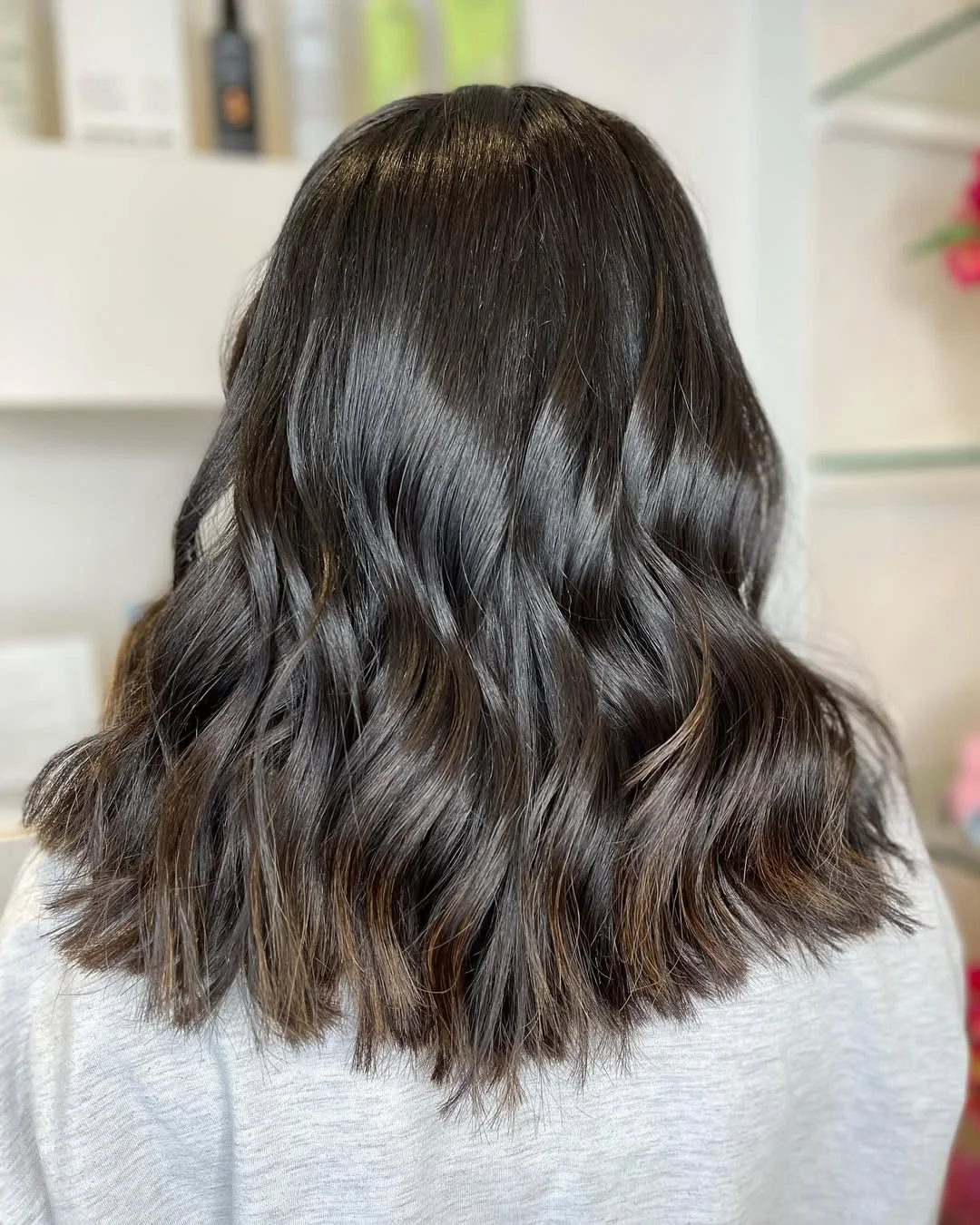 chic summer haircut 2026 Soft Black Lob With Polished Loose Waves