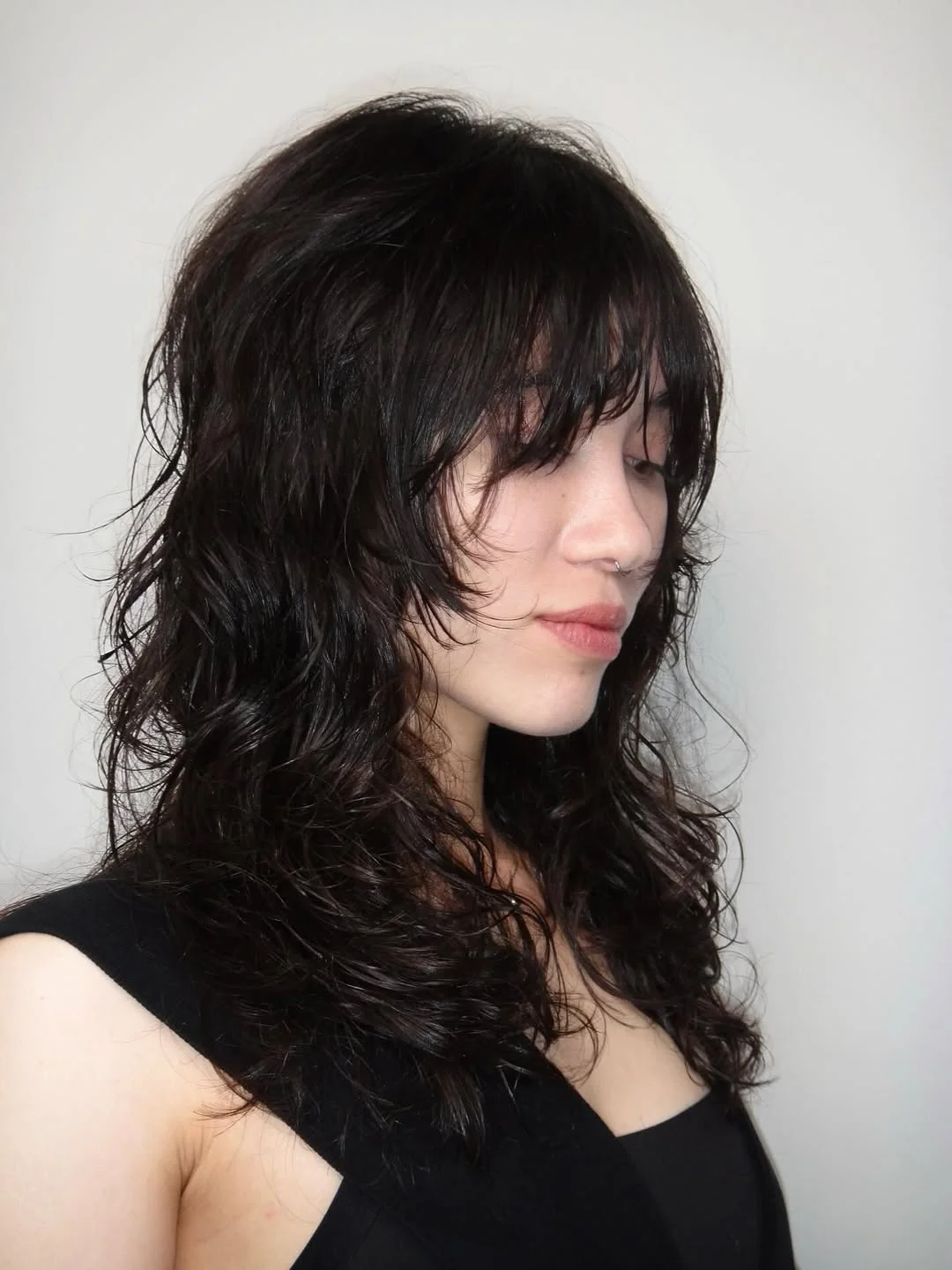 chic summer haircut 2026 Textured Midnight Shag With Airy Face-Framing Pieces
