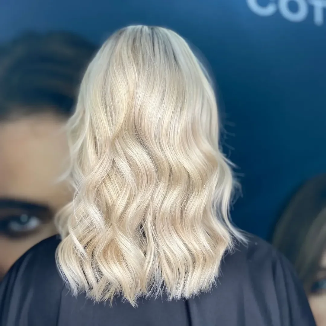 creamy summer blonde hair color 2026 Pearl Cream Blonde With Soft Beachy Bends