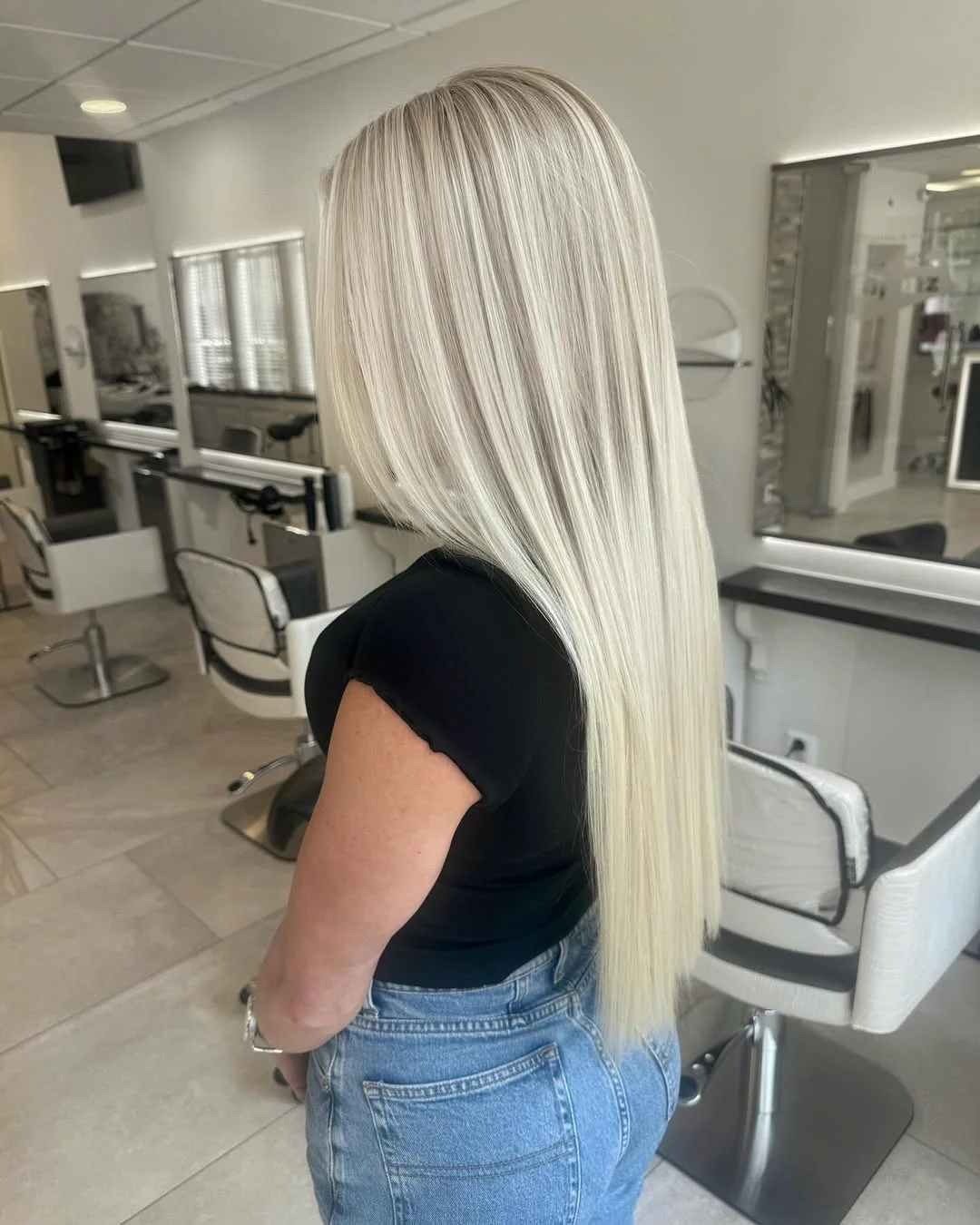 creamy summer blonde hair color 2026 Silky Cream Blonde With a Clean Straight Finish