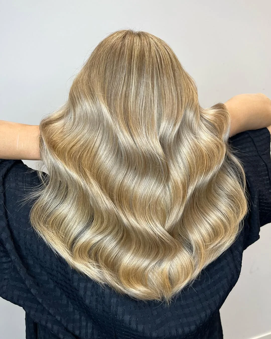 creamy summer blonde hair color 2026 Honey-Cream Waves With Glossy Golden Depth