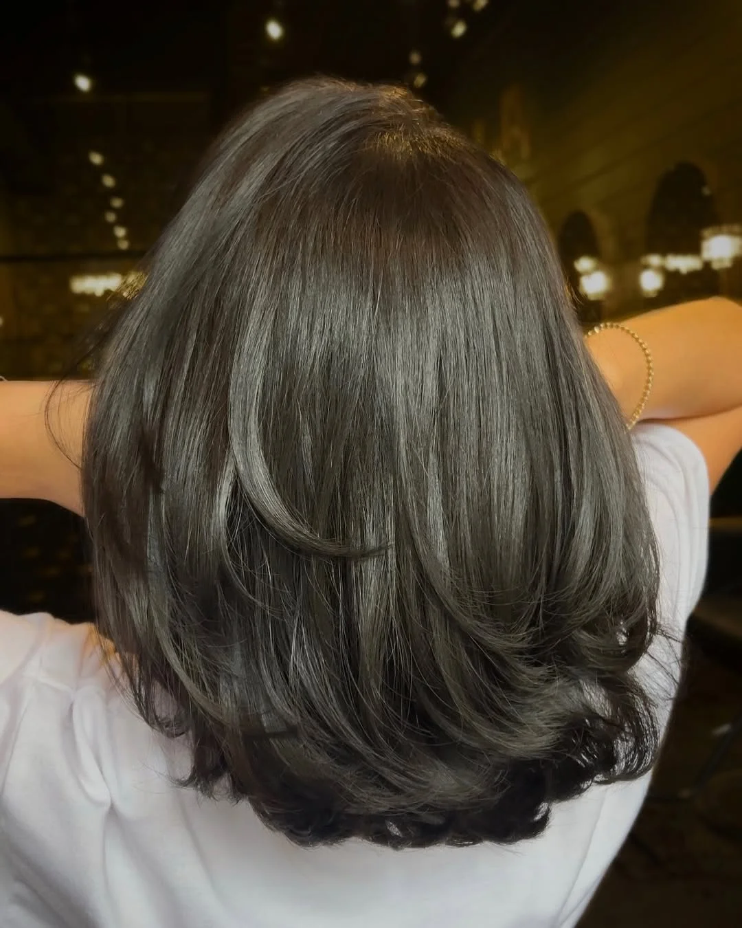 cute summer short haircuts 2026 Smoky Layered Bob With Softly Curled Ends