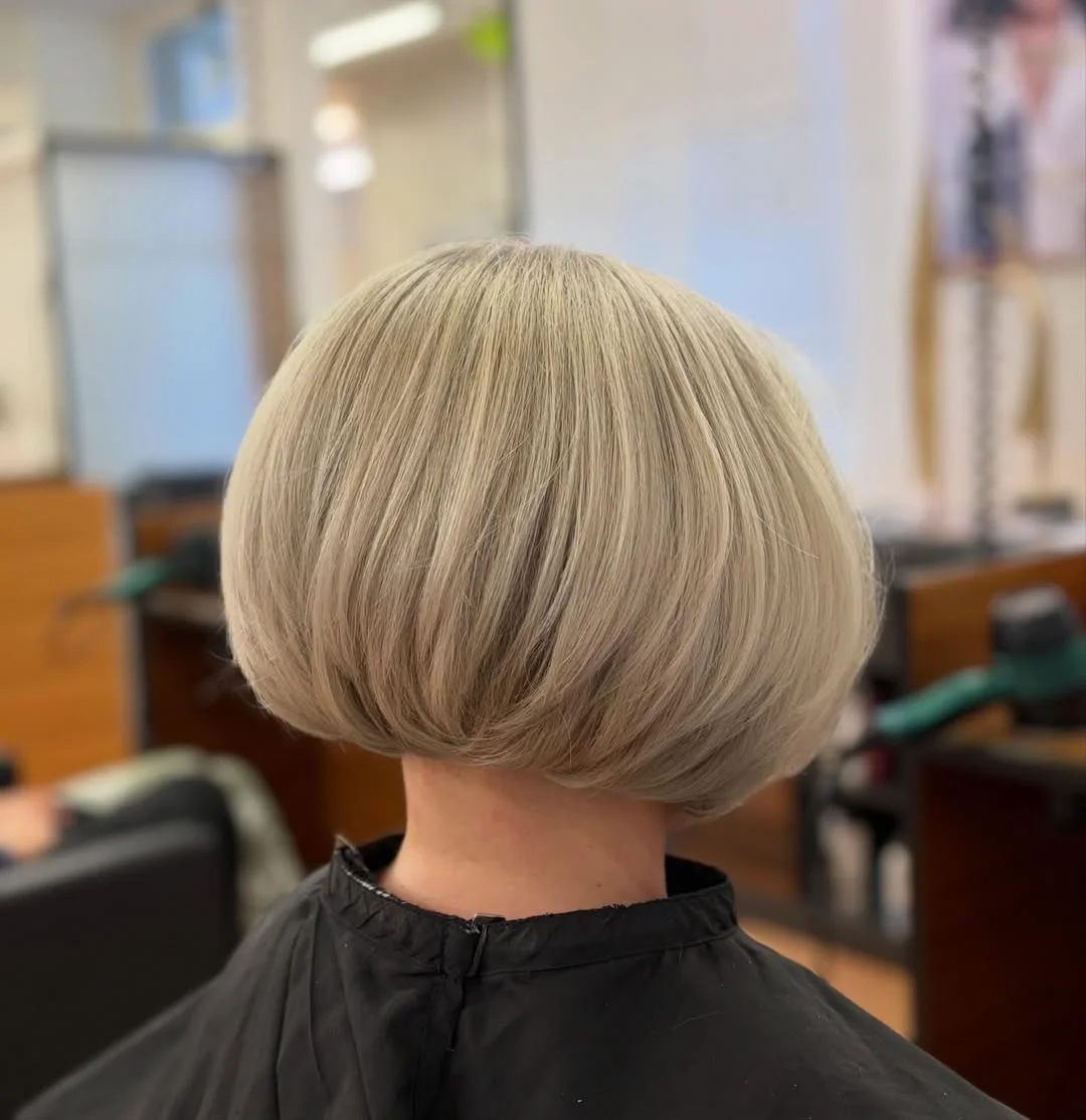 cute summer short haircuts 2026 Rounded Blonde Bowl Bob With A Sculpted Nape