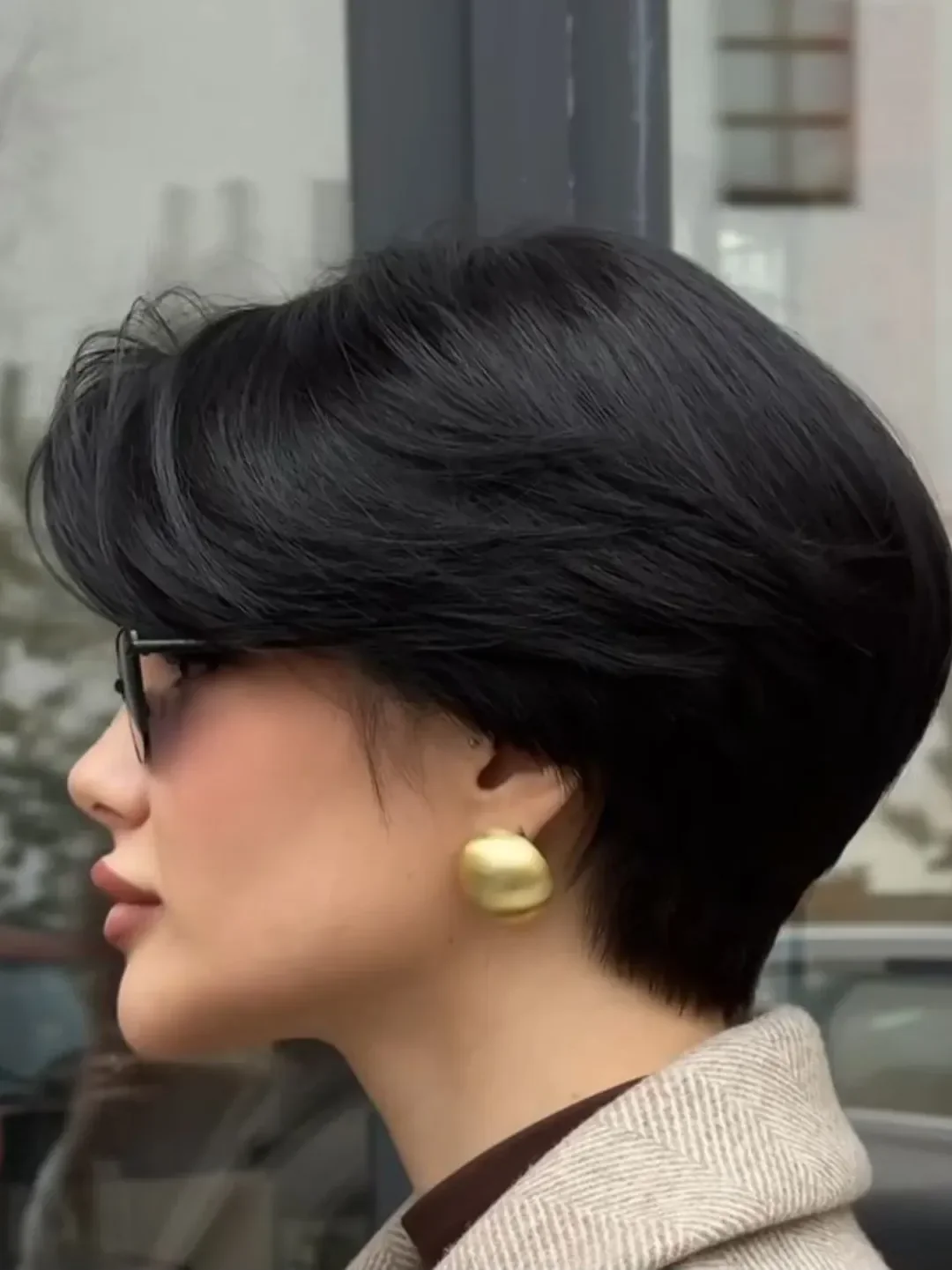 cute summer short haircuts 2026 Glossy Pixie Bob With Sculpted Side Bangs