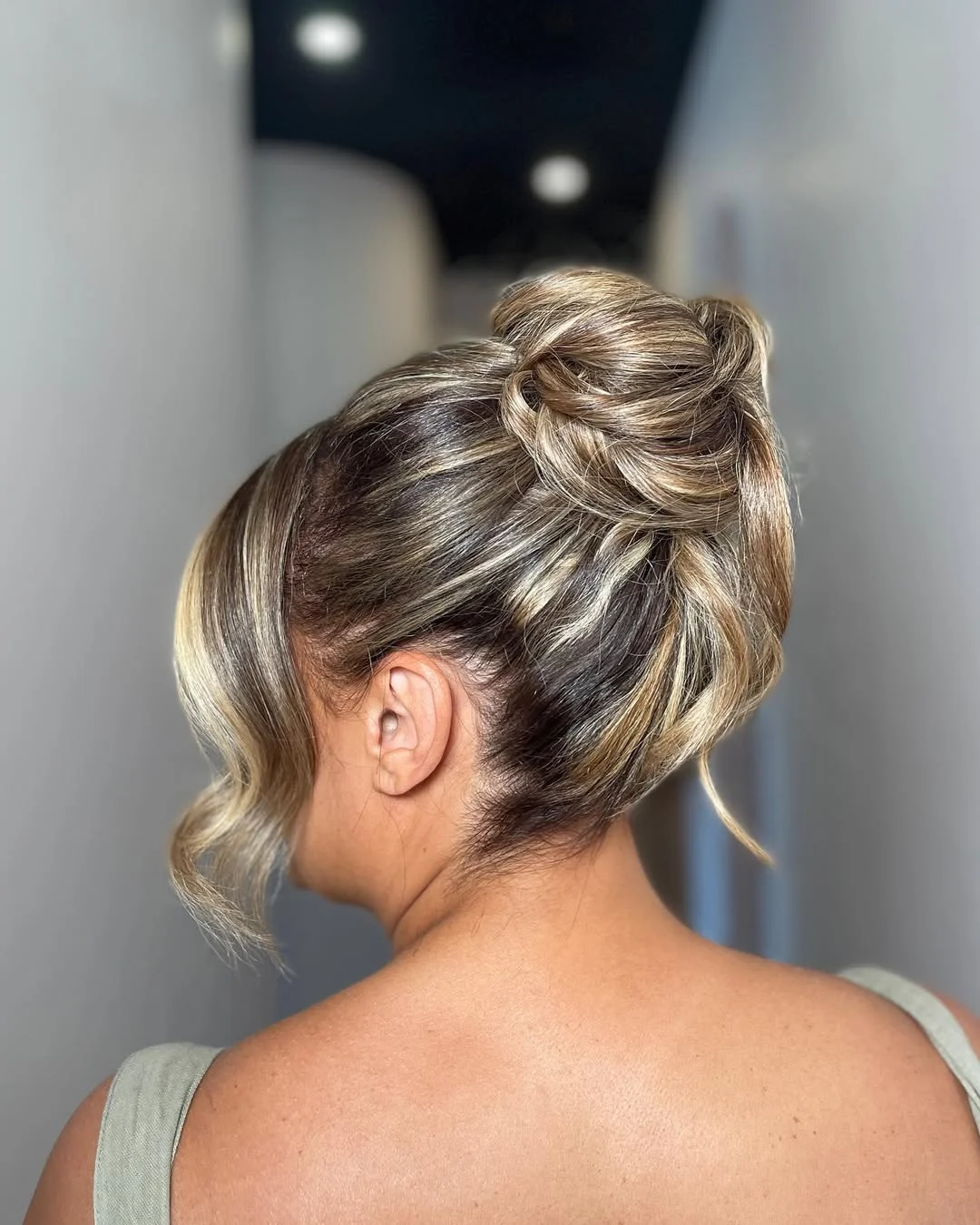 effortless summer easy hairstyle 2026 High Wrapped Bun With Soft Blonde Dimension