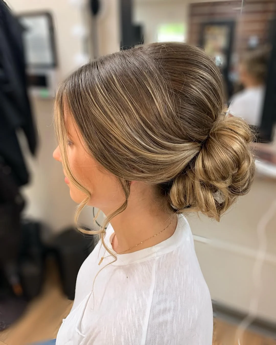 effortless summer easy hairstyle 2026 Low Wrapped Bun With Soft Face Pieces