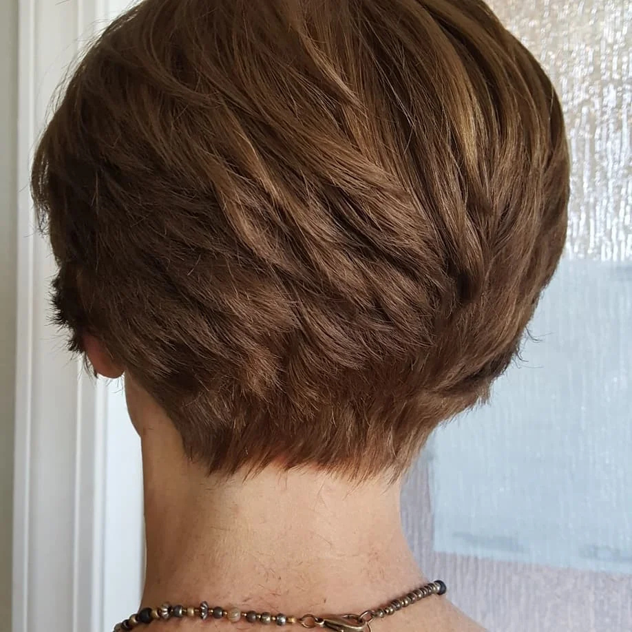 flattering summer haircuts for women over 50 2026 Rounded Tapered Crop With Soft Brunette Texture