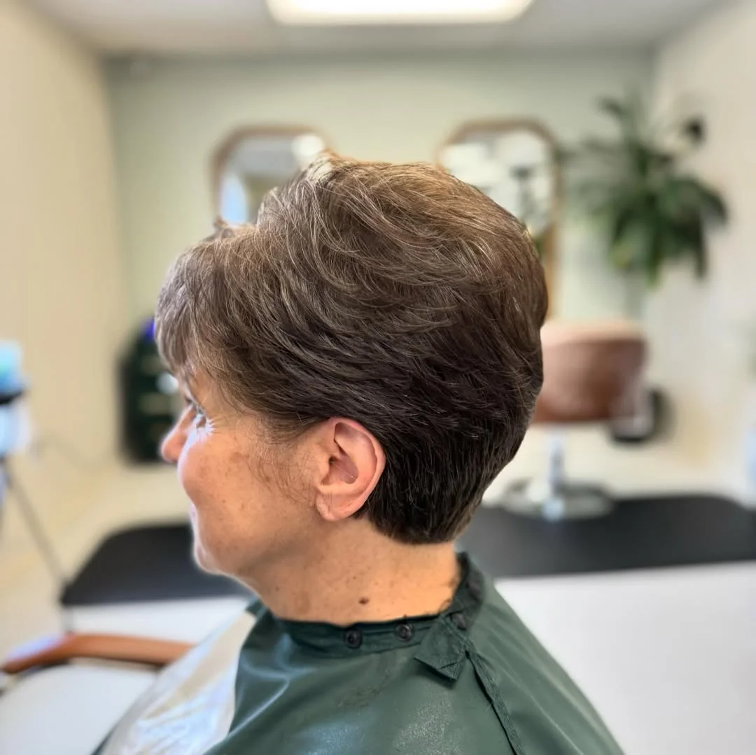 flattering summer haircuts for women over 50 2026 Elegant Tapered Crop With Crown Volume