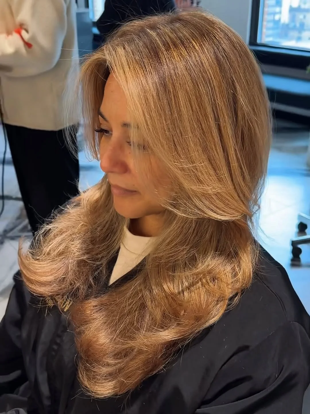 flattering summer haircuts for women over 50 2026 Soft Long Layers With Creamy Blonde Movement