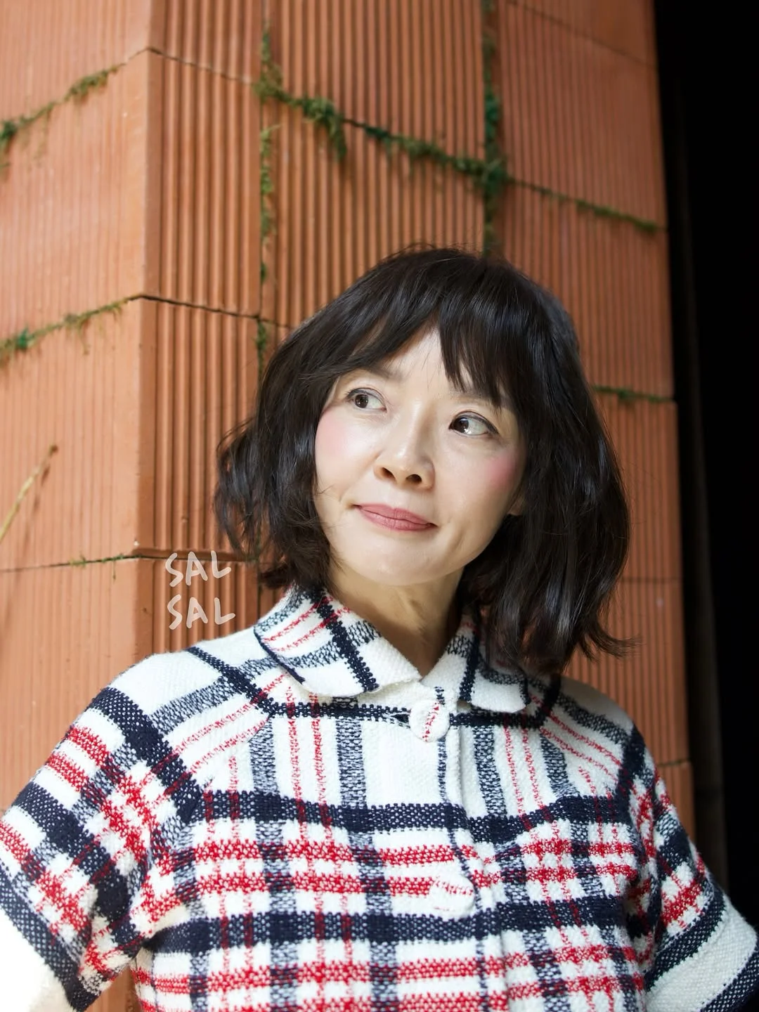 flattering summer haircuts for women over 50 2026 Soft Wavy Bob With Light Bangs