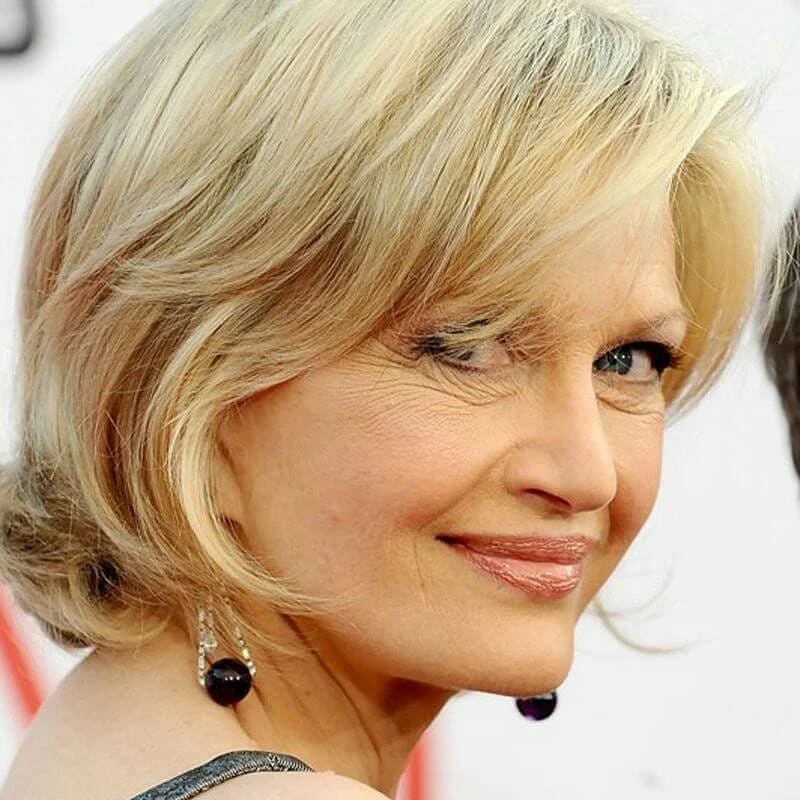 flattering summer haircuts for women over 50 2026 Soft Blonde Side-Swept Bob With Elegant Curve