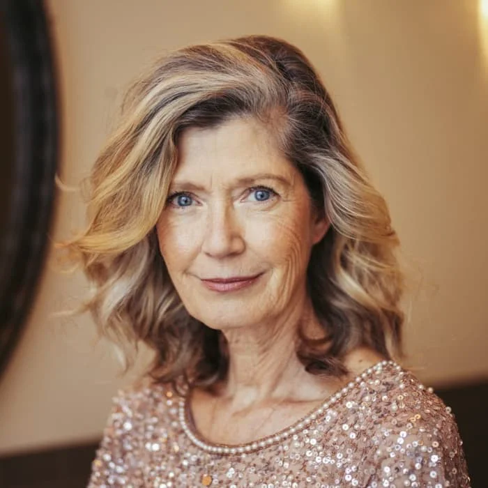 flattering summer haircuts for women over 60 2026 Shoulder-Length Blonde Layers With Soft Side Volume