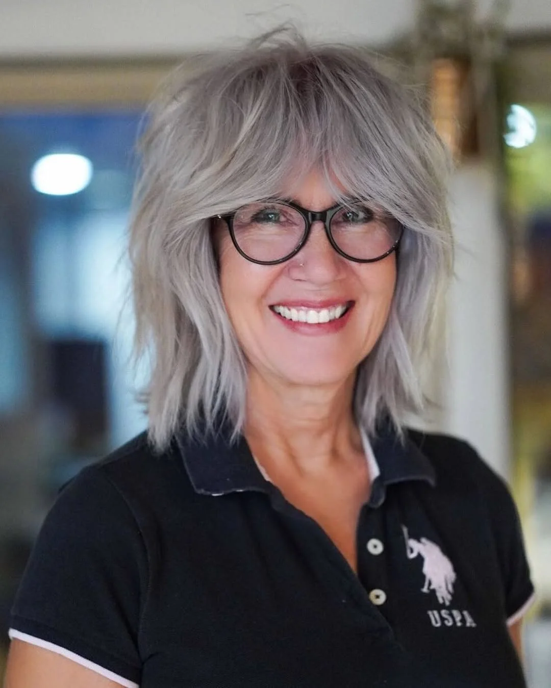 flattering summer haircuts for women over 60 2026 Silver Shag With Full Curtain Bangs