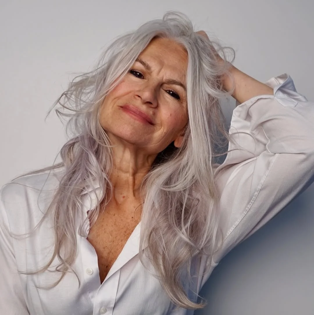 flattering summer haircuts for women over 60 2026 Long Silver Layers With Romantic Movement