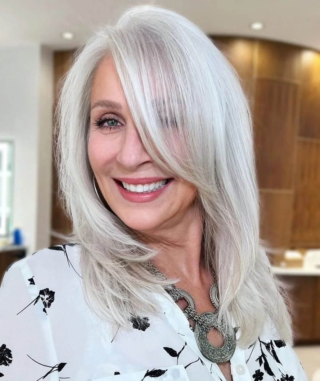 flattering summer haircuts for women over 60 2026 Sleek White Medium Cut With Face-Framing Layers