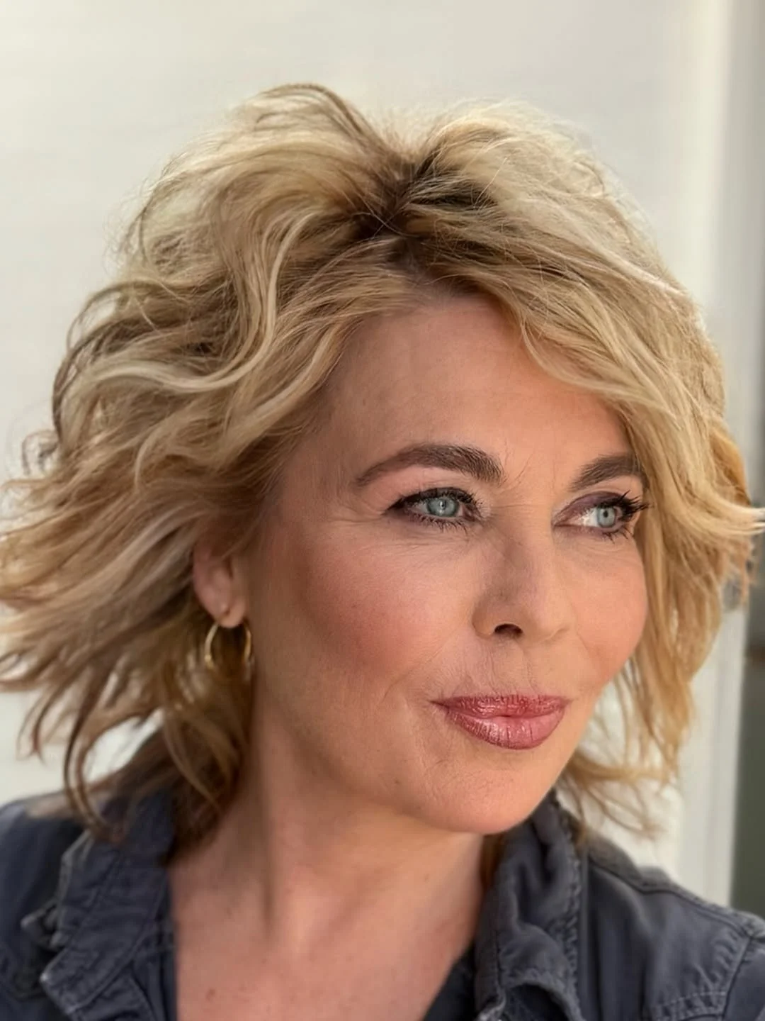 flattering summer haircuts for women over 60 2026 Textured Blonde Lob With Breezy Waves