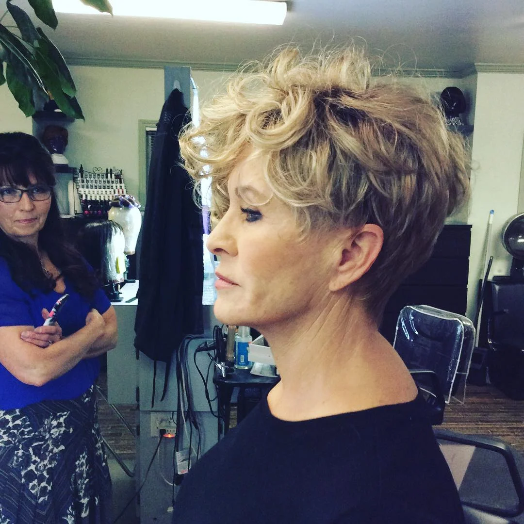 flattering summer haircuts for women over 60 2026 Curly Blonde Pixie With Lifted Crown