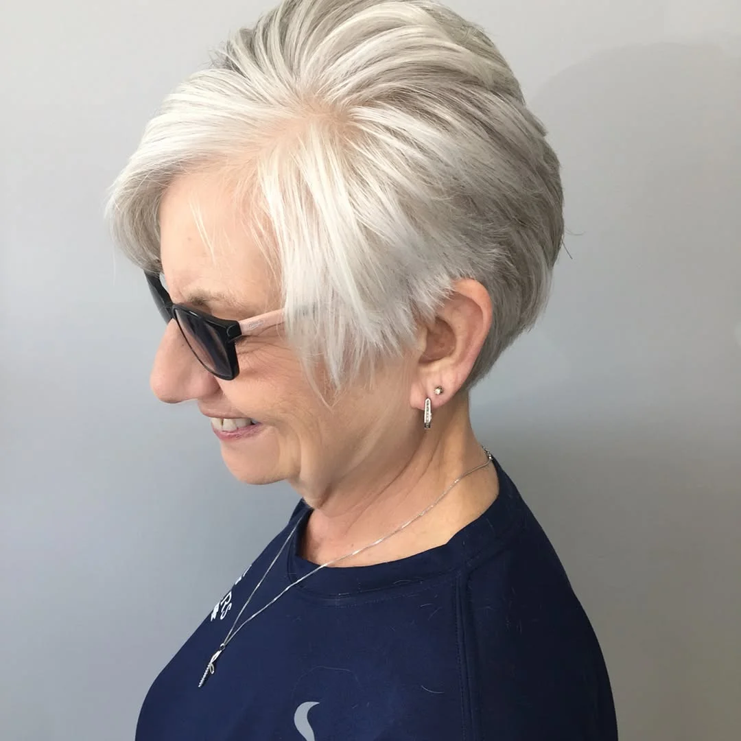 flattering summer haircuts for women over 60 2026 Elegant White Side-Swept Crop