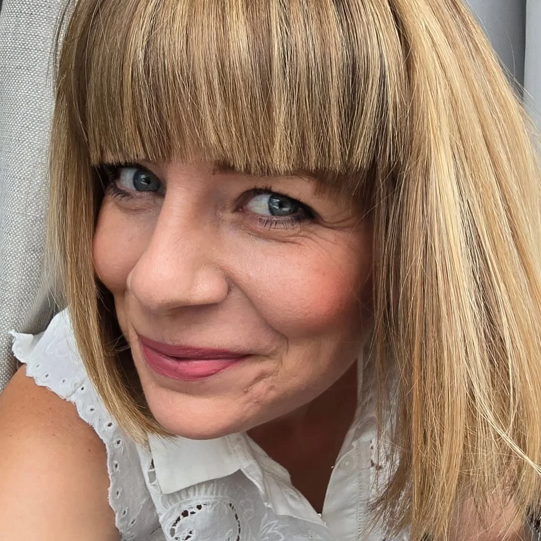 flattering summer haircuts for women over 60 2026 Blunt Blonde Bob With Full Fringe