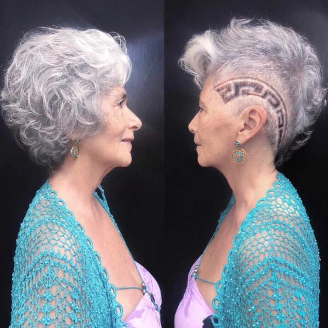 flattering summer haircuts for women over 60 2026 Curly Silver Pixie With Bold Undercut Detail