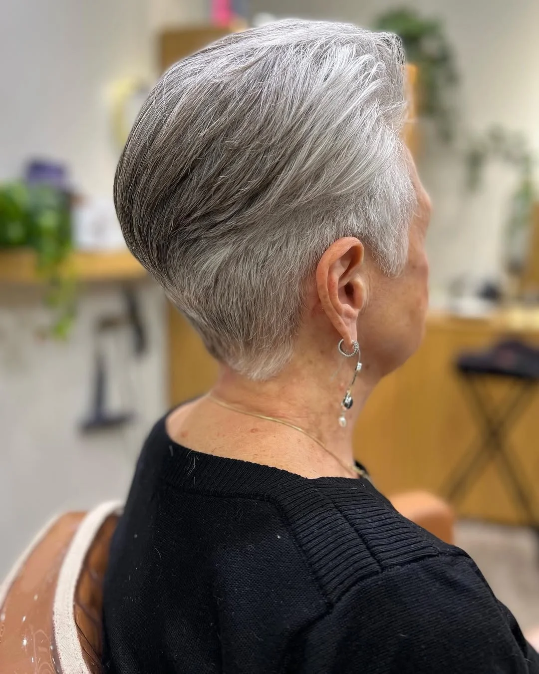 flattering summer haircuts for women over 60 2026 Sleek Silver Tapered Pixie Bob