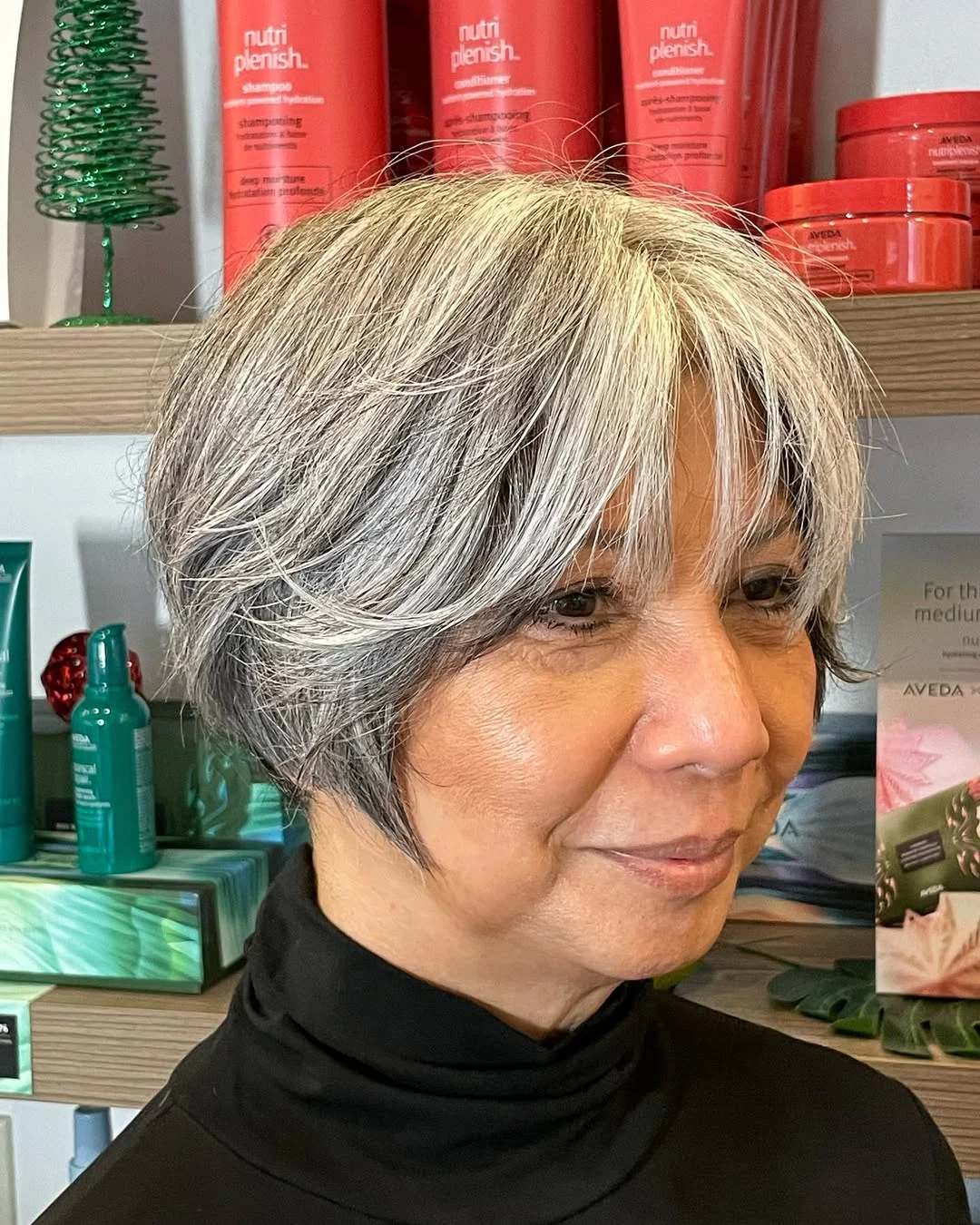 flattering summer haircuts for women over 60 2026 Layered Silver Bixie With Soft Face-Framing Bangs