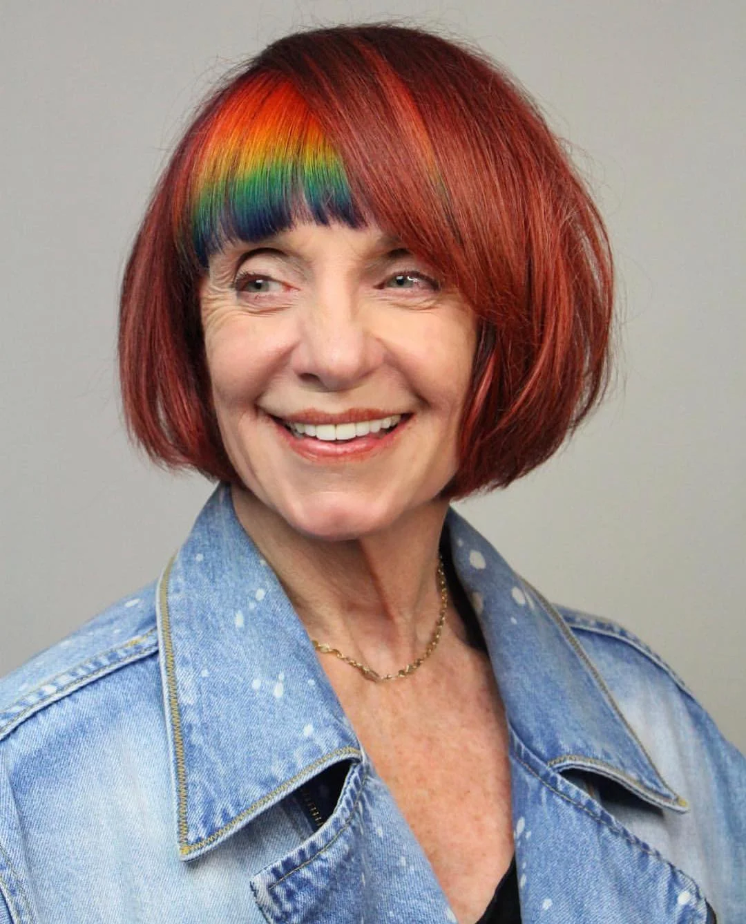 flattering summer haircuts for women over 60 2026 Cherry Red Bob With Rainbow Fringe