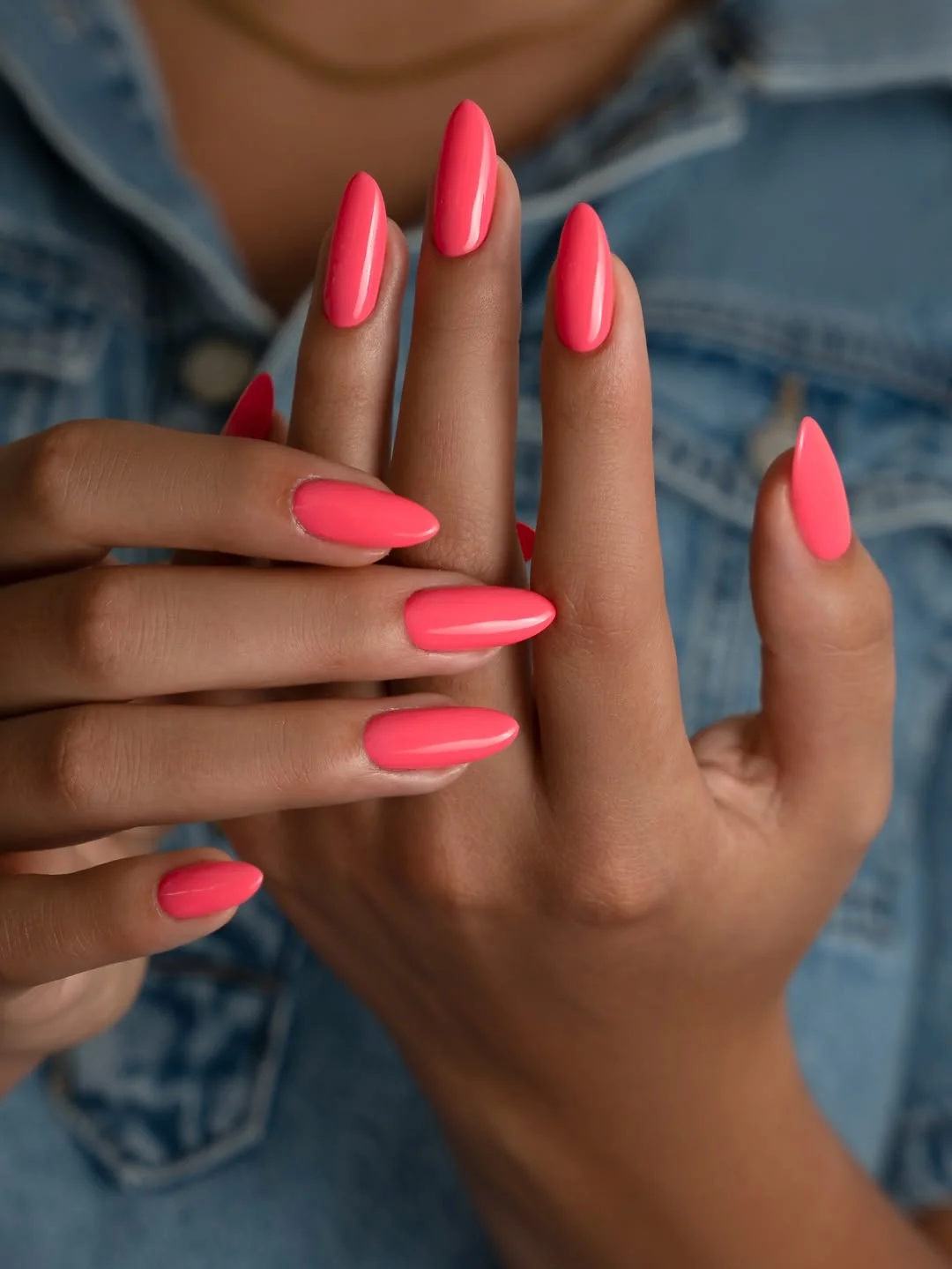 light summer nails 2026 Glossy Coral Pink Almond Nails For A Fresh Summer Glow