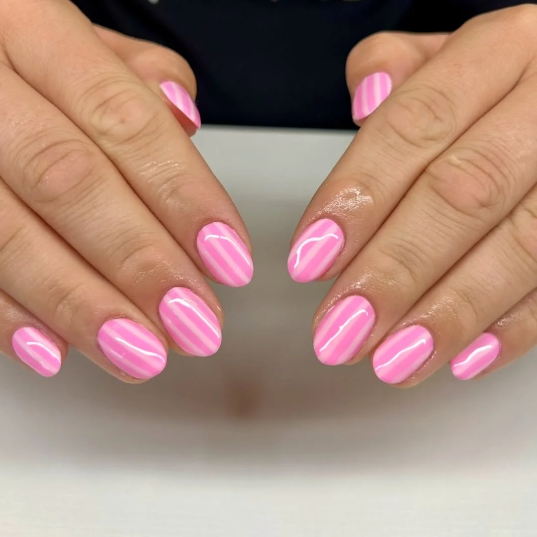 light summer nails 2026 Glossy Pink Striped Nails With A Candy-Summer Feel