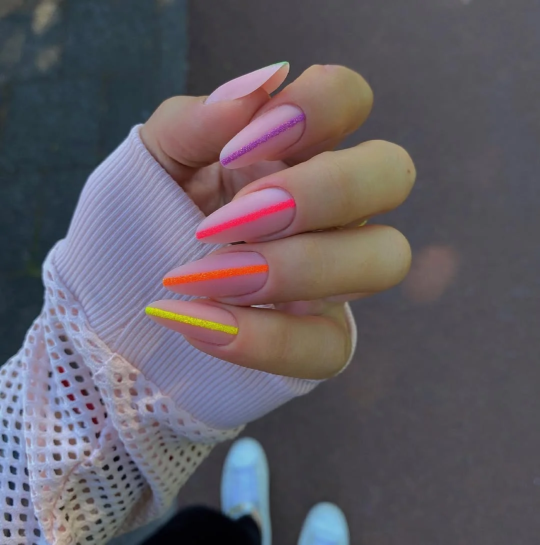 light summer nails 2026 Sheer Almond Nails With Bright Glitter Stripe Tips