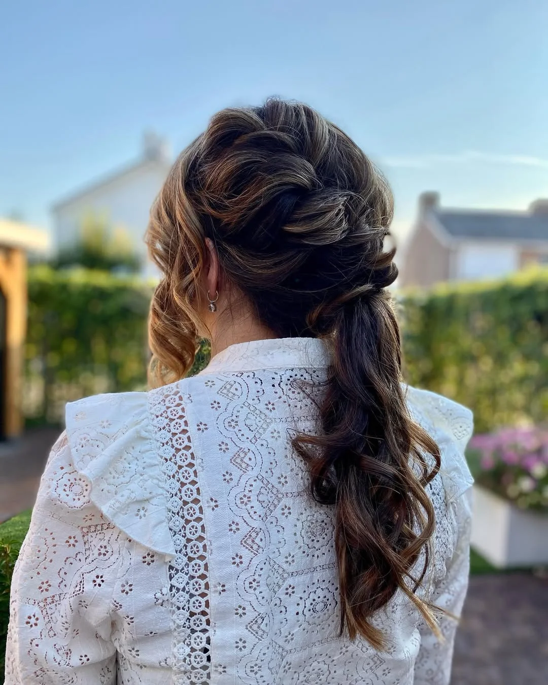 low summer ponytail hairstyle 2026 Twisted Low Ponytail with Soft Outdoor Waves