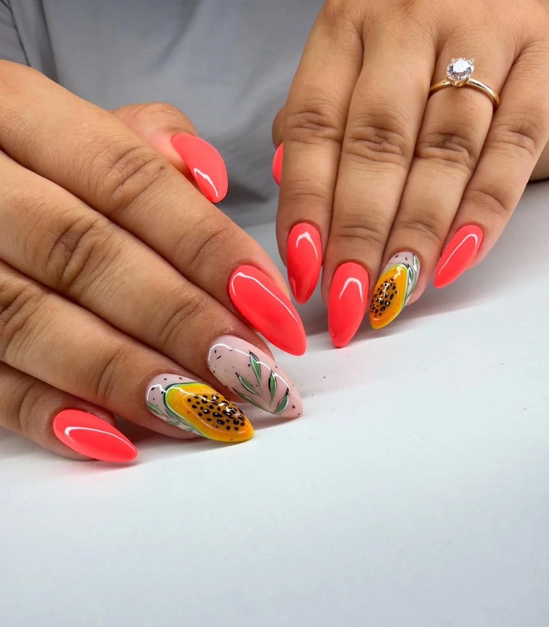 neon summer nails 2026 Neon Coral Almond Nails with Tropical Fruit Accents