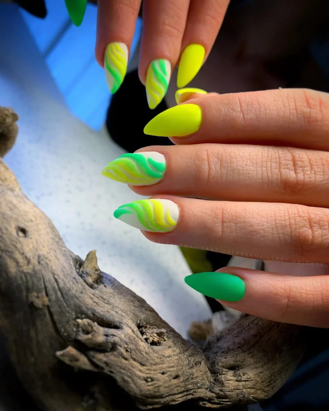 neon summer nails 2026 Neon Green Almond Nails with Soft Swirl Accents