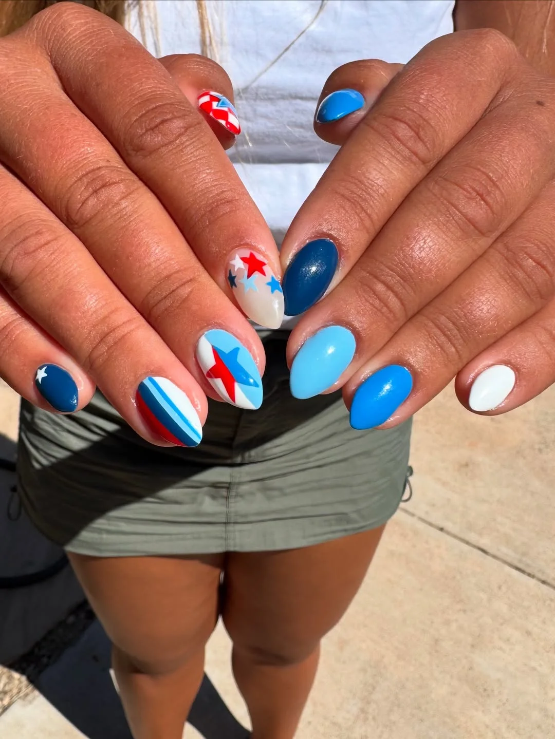 patriotic nails 2026 Bright Blue Almond Nails With Graphic Star Accents