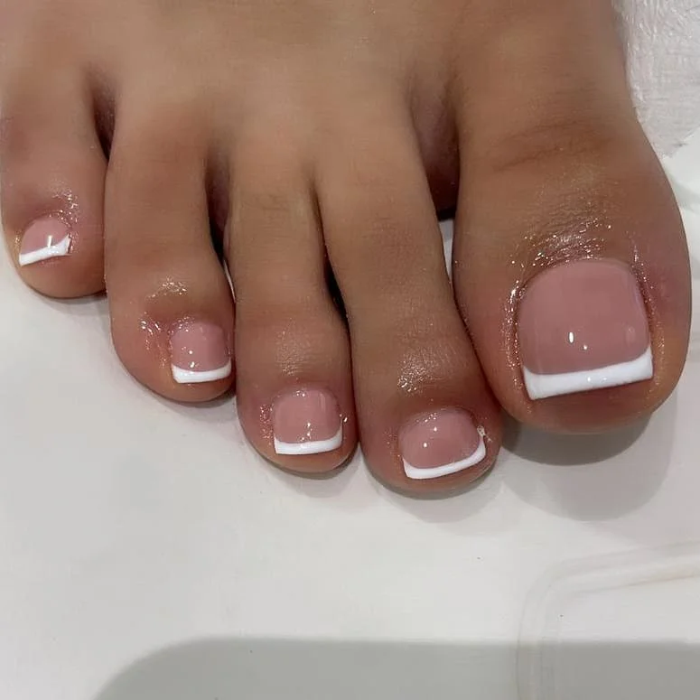 pedicure ideas - summer trends 2026 Clean White French Tip Pedicure For Timeless Summer Sandals
