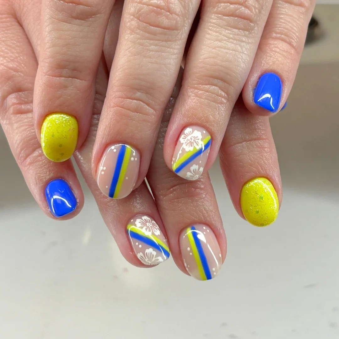 short gel nails summer 2026 Blue And Yellow Floral Stripe Nails For A Fresh Summer Pop