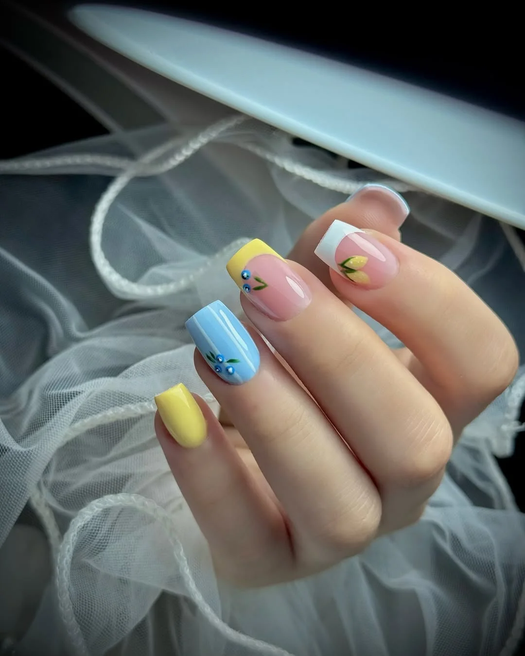short gel nails summer 2026 Pastel Blue And Yellow Floral French Tips With A Soft Square Shape