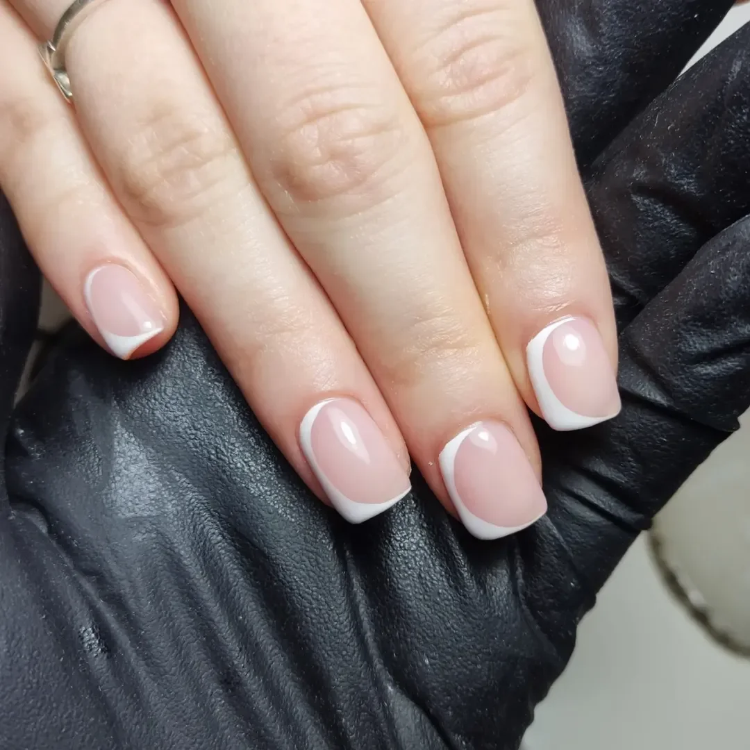 short squoval nails design 2026 Rounded White French with a Soft Pink Base