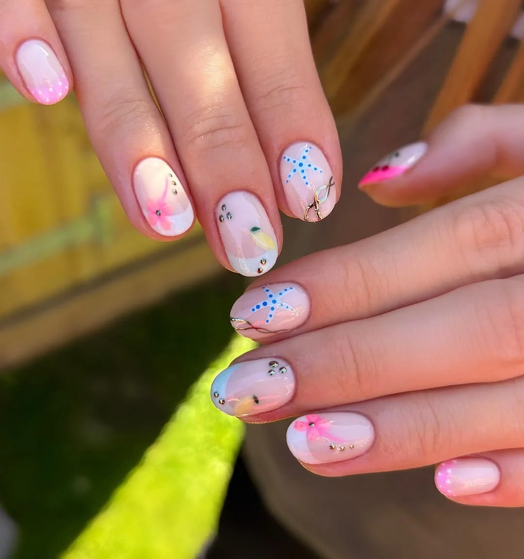 short summer nails 2026 Soft Floral Starfish Nails With Tiny Crystals