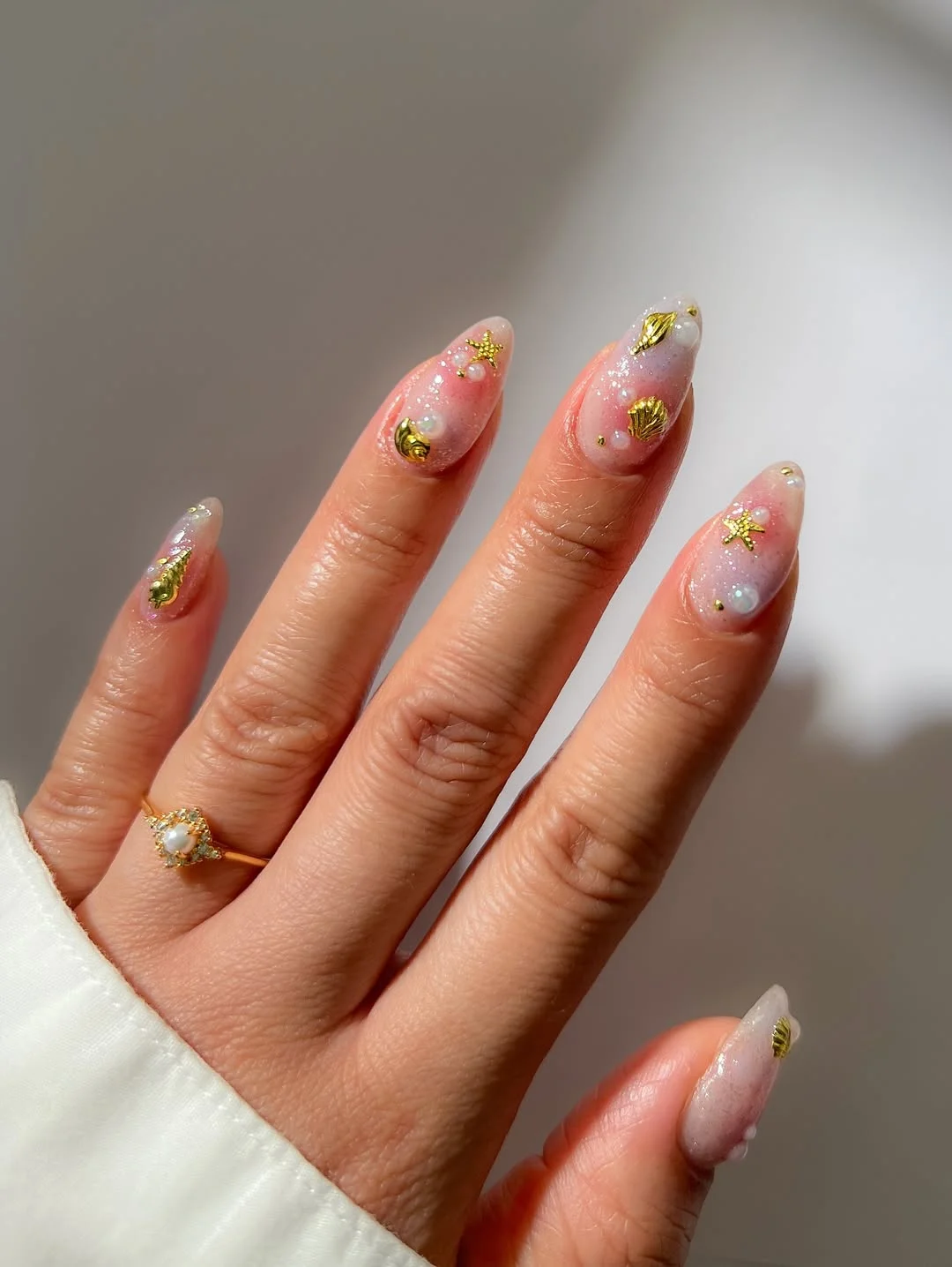 summer beach nails 2026 Pearly Seashell Nails With Gold Beach Charms