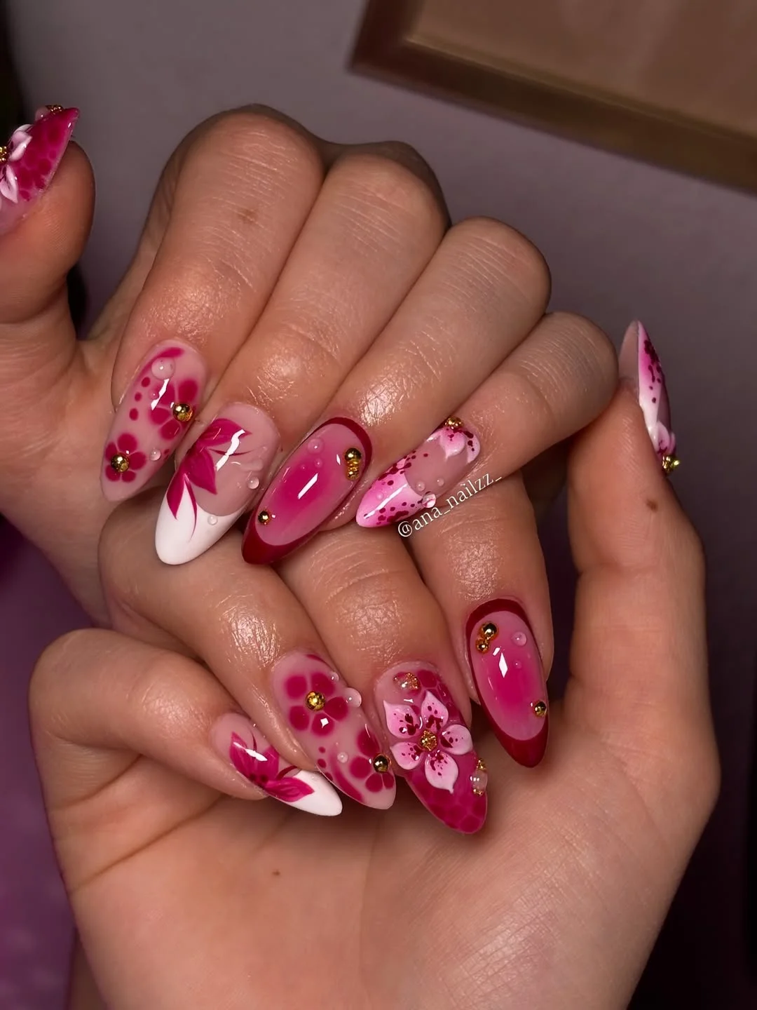 summer dip nails 2026 Fuchsia Floral Almond Nails With Gold Accent Details