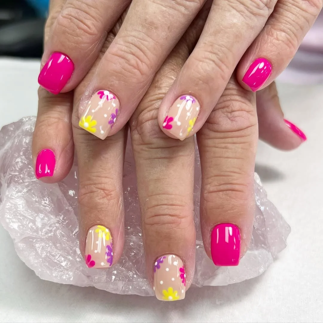 summer flower nails 2026 Hot Pink Floral Accents With a Soft Nude Base
