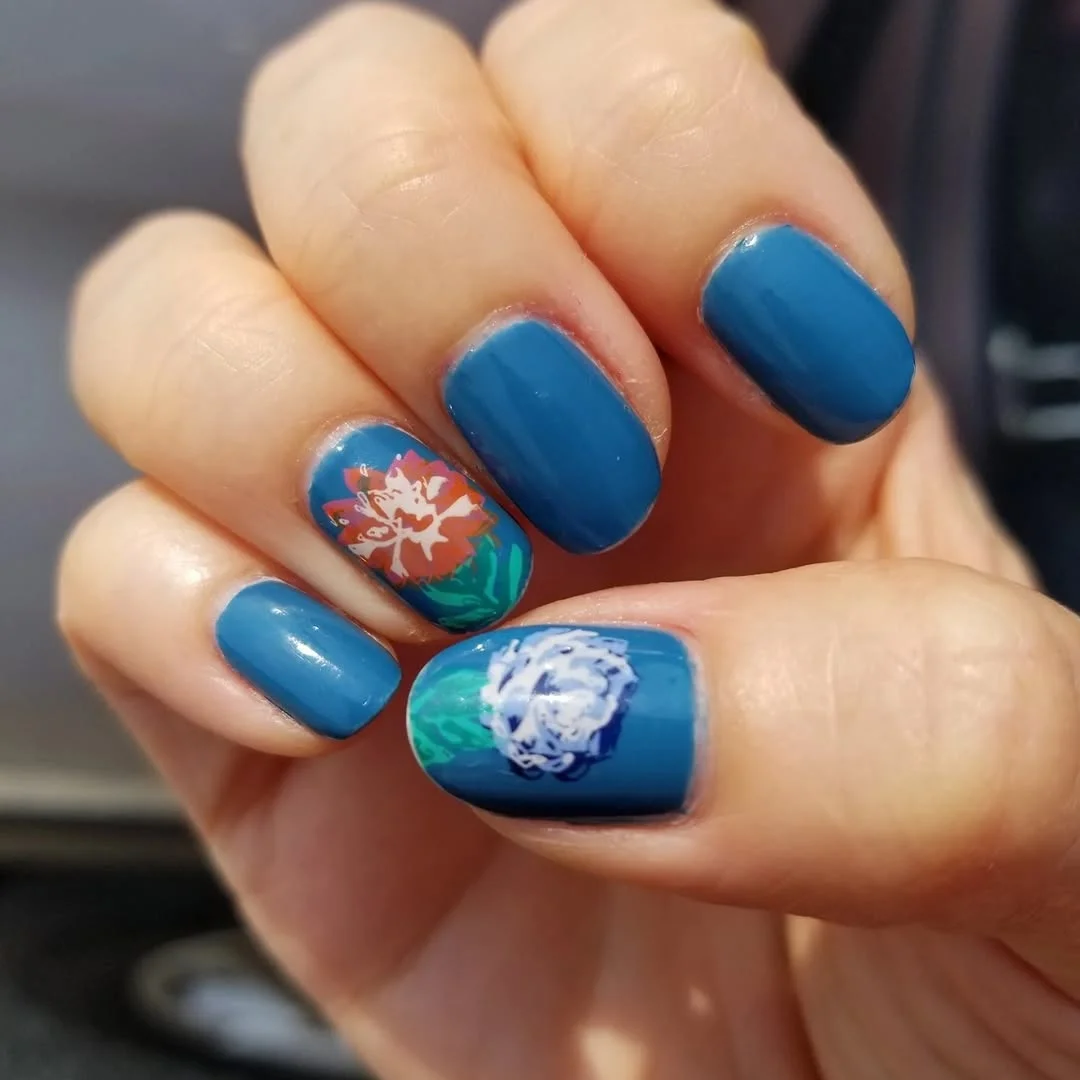 summer flower nails 2026 Moody Blue Floral Nails With a Painterly Finish