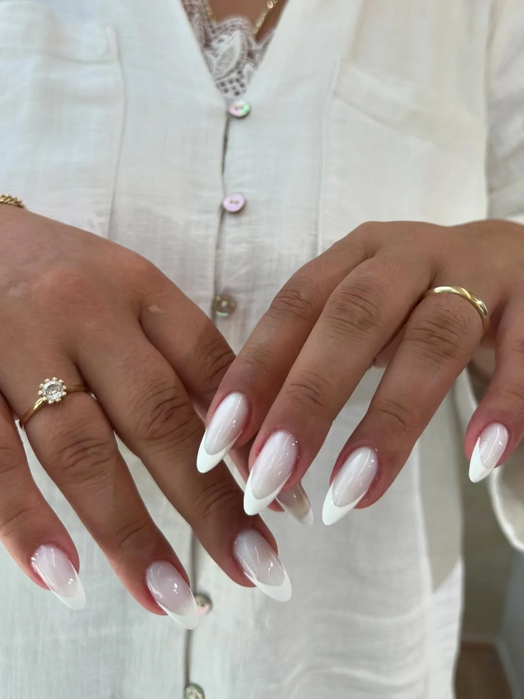 summer french tip nails 2026 Glossy White Almond French Tips With A Soft Milky Base