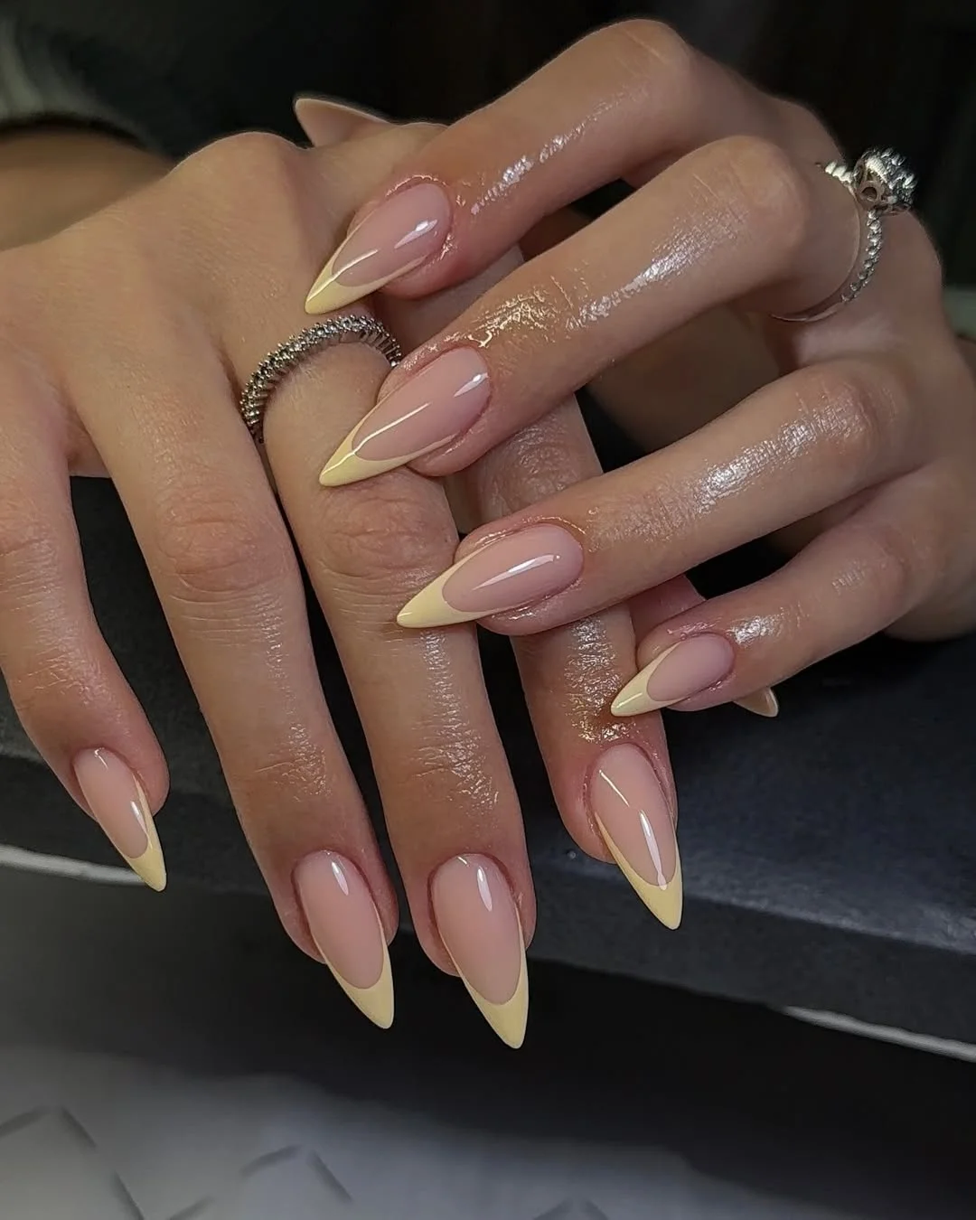 summer french tip nails 2026 Pastel Yellow Stiletto French Tips With A Sleek Nude Base